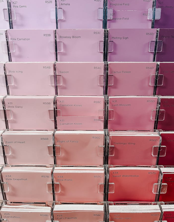 services-03 A vertical shot of pink-themed paint sample cards arranged in a grid pattern.